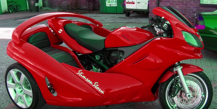 Red three-wheeled vehicle