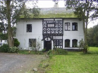 Old white two-storey house