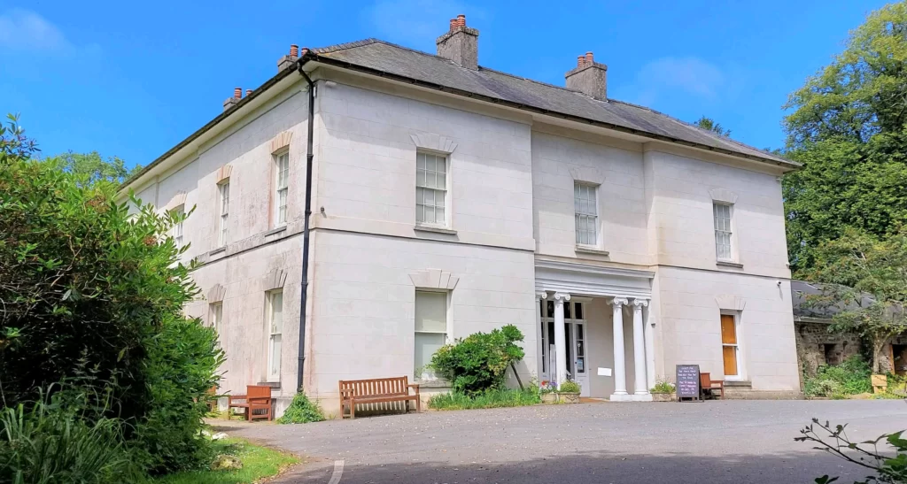 Large two-storey white building 